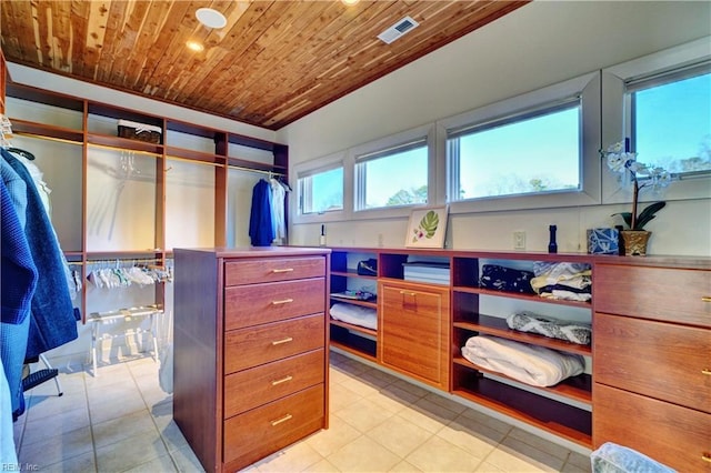 spacious closet with light tile patterned flooring