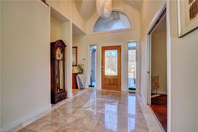 entryway with a high ceiling