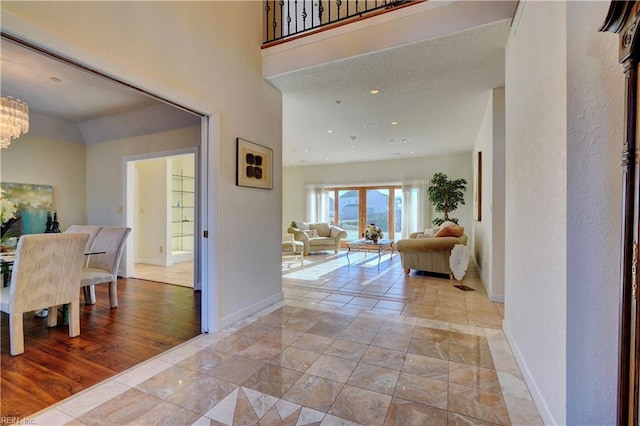 foyer with a chandelier