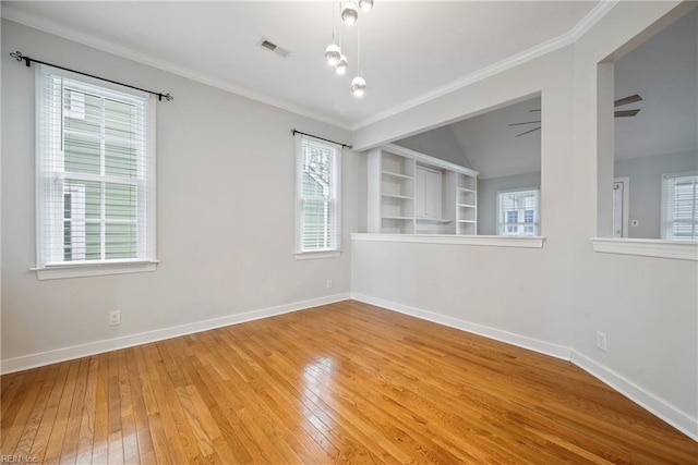 unfurnished room featuring wood-type flooring, ornamental molding, and ceiling fan