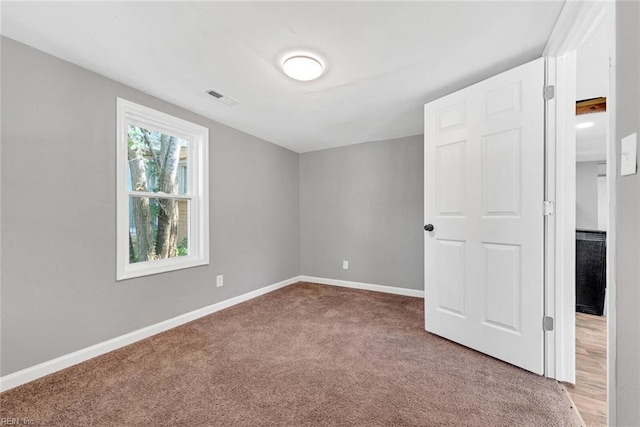 view of carpeted spare room