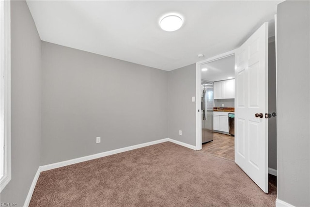 empty room with light colored carpet