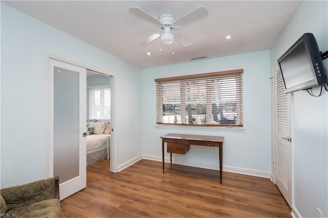 corridor with dark hardwood / wood-style floors