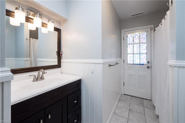 bathroom with vanity and tile patterned floors