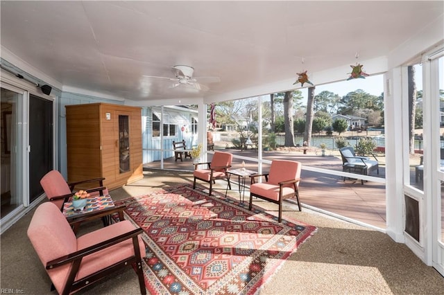 sunroom featuring ceiling fan