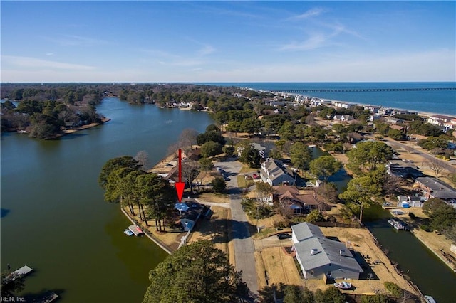 birds eye view of property featuring a water view