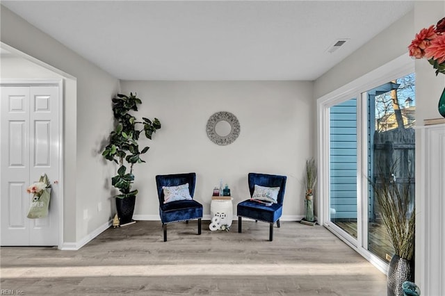 living area featuring light hardwood / wood-style floors