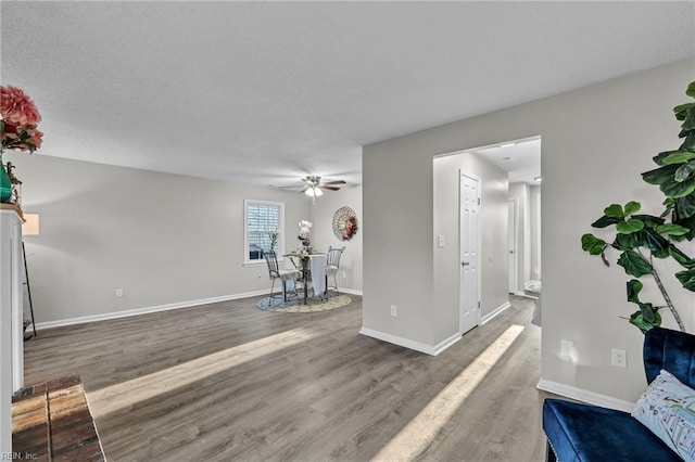 interior space featuring ceiling fan and hardwood / wood-style floors