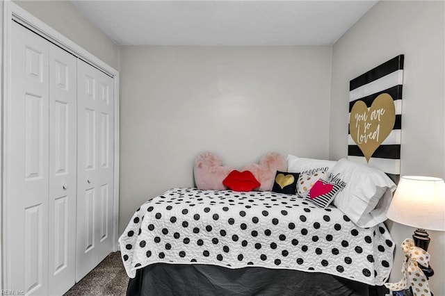 carpeted bedroom featuring a closet