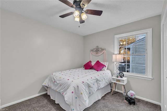 bedroom with carpet flooring, a textured ceiling, and ceiling fan