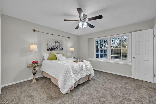 bedroom with ceiling fan and carpet