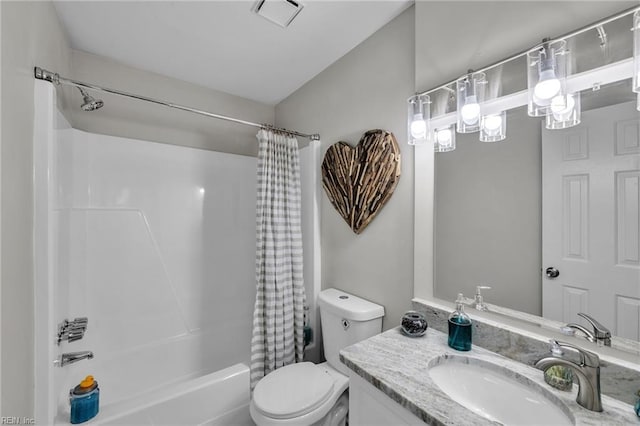 full bathroom featuring shower / bathtub combination with curtain, vanity, and toilet