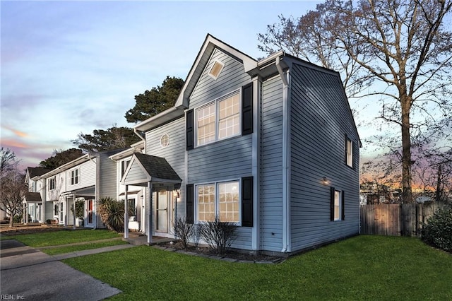 view of front of home with a yard