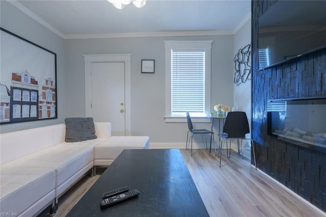 living room featuring crown molding and wood-type flooring