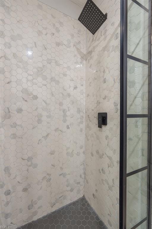 bathroom with a tile shower