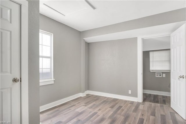 unfurnished room featuring light hardwood / wood-style floors