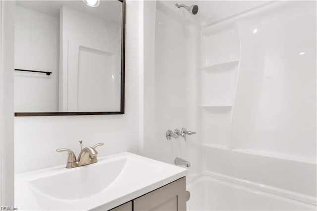 bathroom with vanity and washtub / shower combination