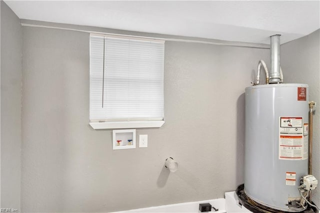 utility room featuring water heater