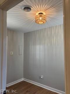 spare room featuring dark hardwood / wood-style flooring