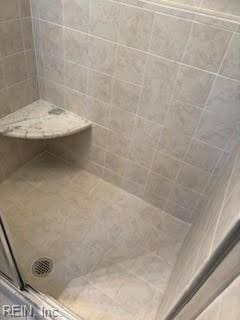 bathroom featuring walk in shower