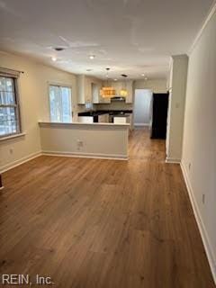 kitchen with hardwood / wood-style floors and kitchen peninsula