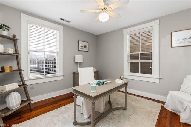 office featuring wood-type flooring and ceiling fan