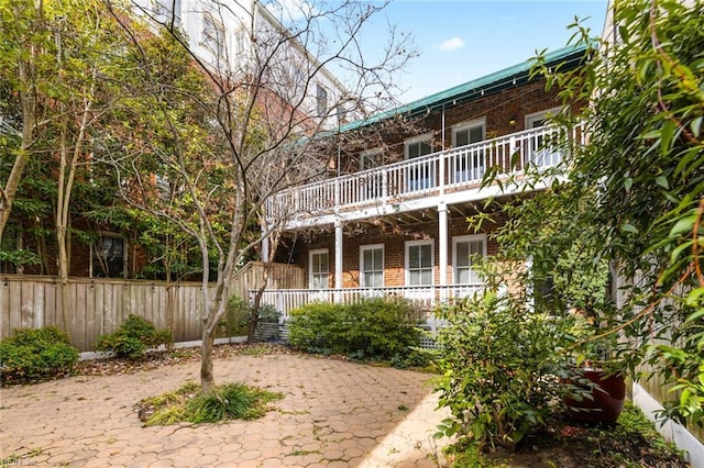 exterior space with a balcony and a patio area