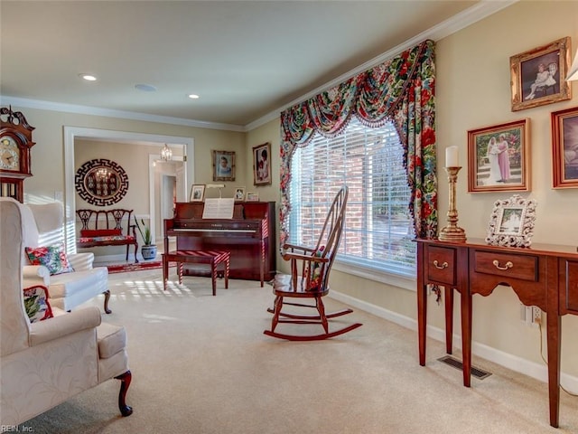 living area featuring ornamental molding and light carpet