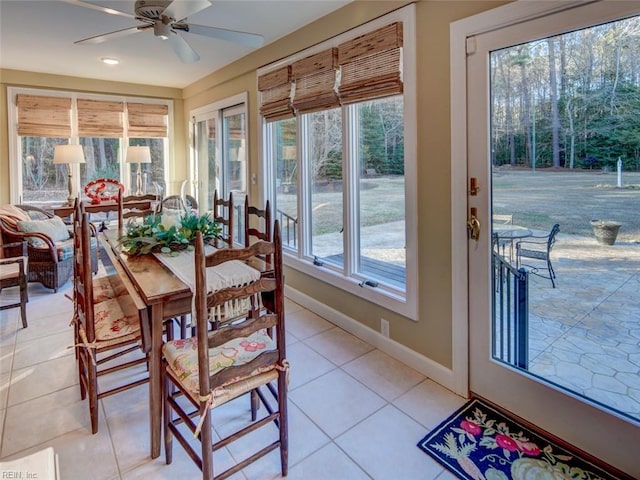 sunroom featuring ceiling fan