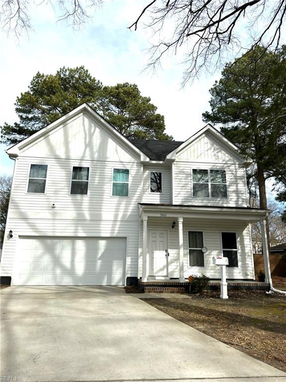 view of front facade featuring a porch and a garage