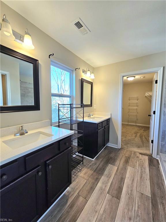 bathroom with vanity and hardwood / wood-style floors