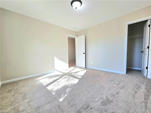 unfurnished bedroom featuring carpet floors and a closet