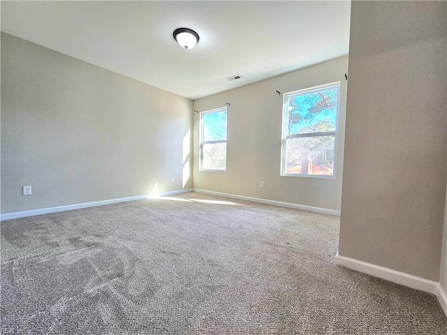 unfurnished room with carpet floors