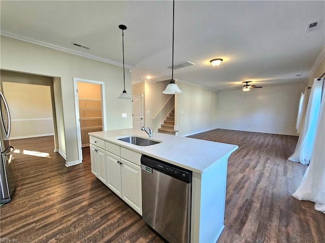 kitchen featuring sink, white cabinets, hanging light fixtures, stainless steel dishwasher, and a center island with sink