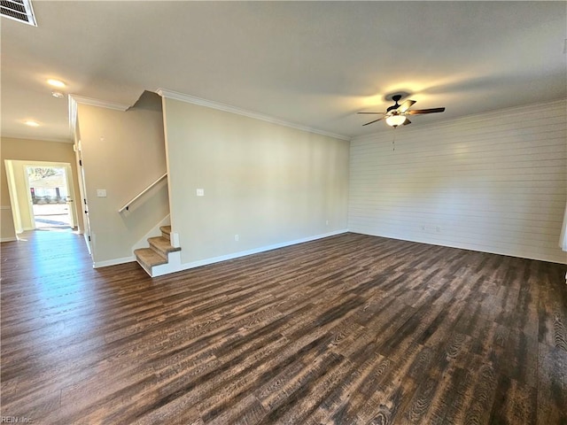 spare room featuring ornamental molding, ceiling fan, and dark hardwood / wood-style flooring