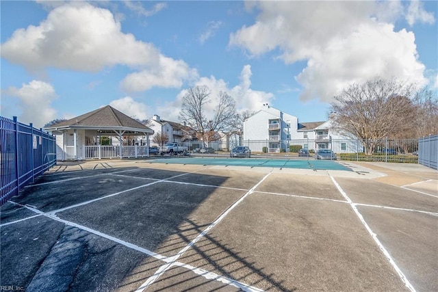 view of sport court with a gazebo