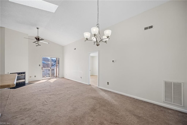 unfurnished living room featuring ceiling fan, a skylight, high vaulted ceiling, carpet, and heating unit