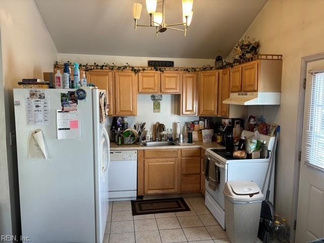 kitchen with sink, vaulted ceiling, light tile patterned floors, pendant lighting, and white appliances