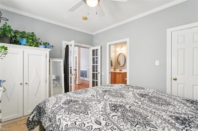 bedroom with crown molding, ceiling fan, and ensuite bath