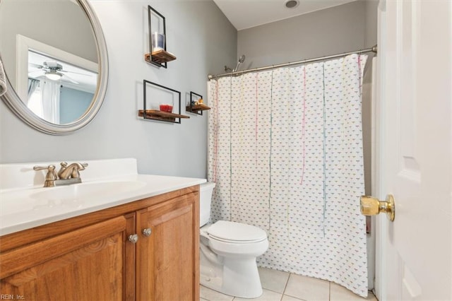 bathroom with tile patterned flooring, vanity, curtained shower, and toilet