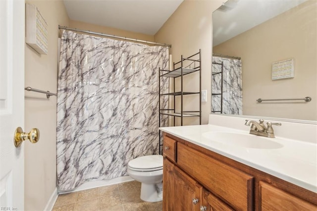 bathroom featuring tile patterned flooring, vanity, a shower with shower curtain, and toilet