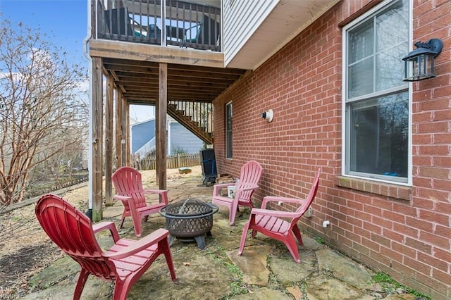 view of patio with an outdoor fire pit