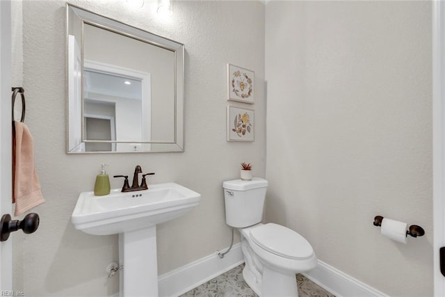 bathroom with sink and toilet