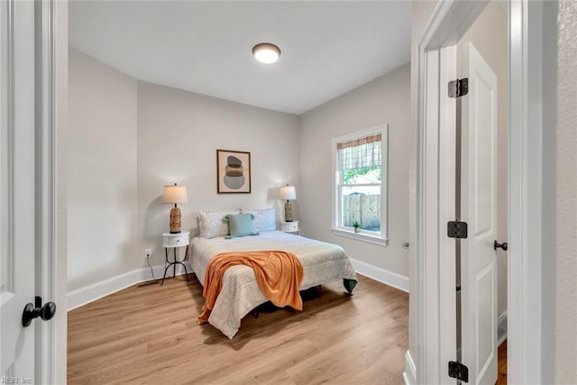 bedroom with light hardwood / wood-style flooring