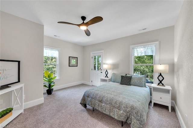 carpeted bedroom with ceiling fan