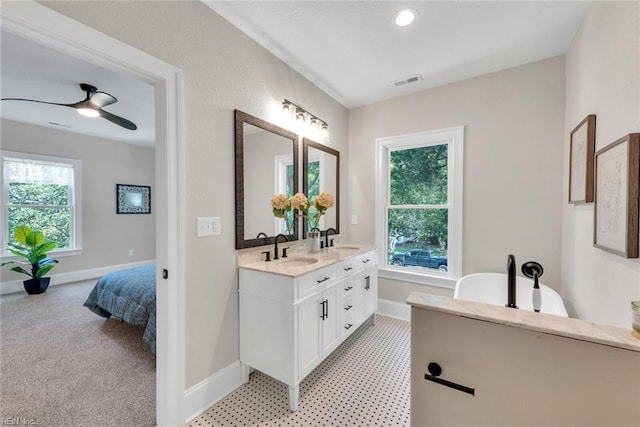 bathroom with vanity, a wealth of natural light, and ceiling fan