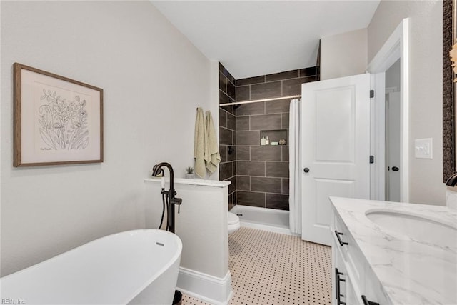 full bathroom featuring vanity, toilet, and separate shower and tub