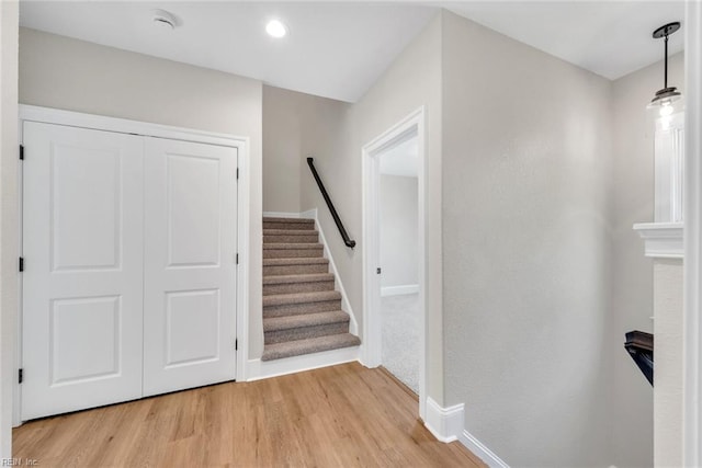 stairs featuring wood-type flooring