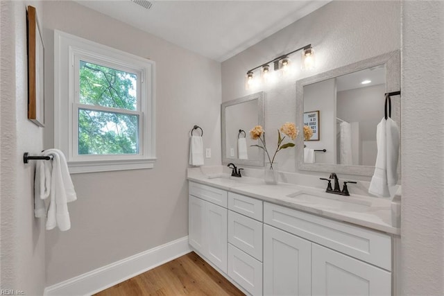 bathroom with vanity, hardwood / wood-style floors, and a shower with curtain