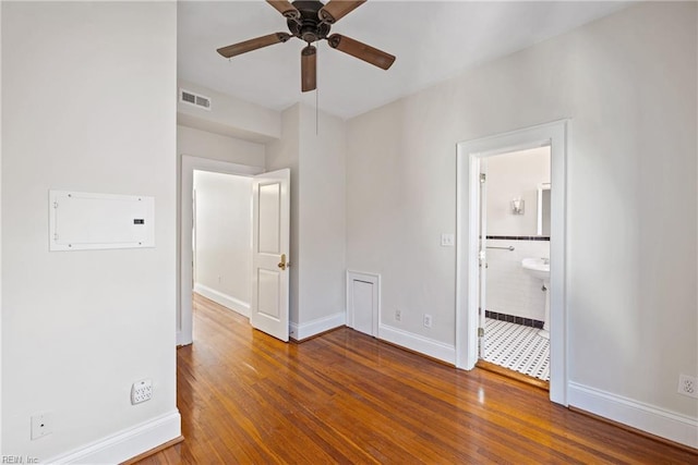 spare room featuring ceiling fan and wood-type flooring